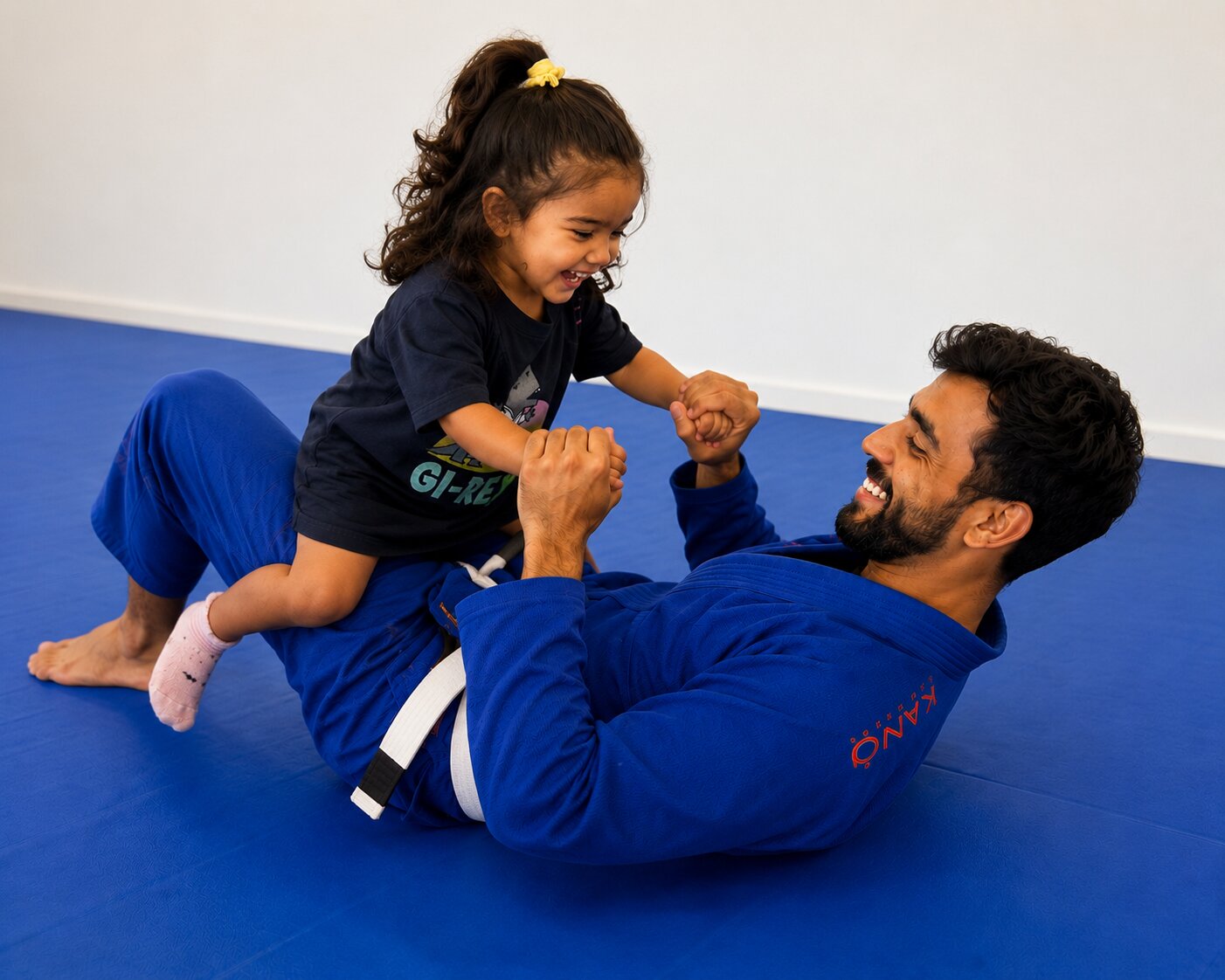 Father and daughter playing together on the mats